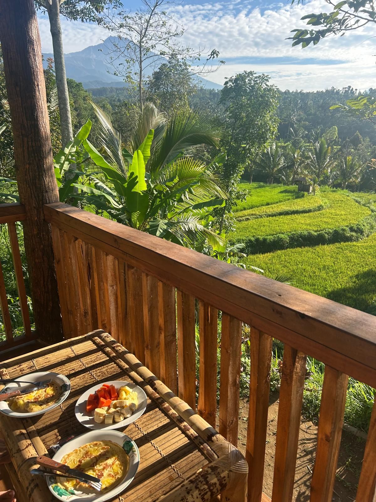 Breakfast on the terrace looking over the rice terraces towards Mount Rinjani